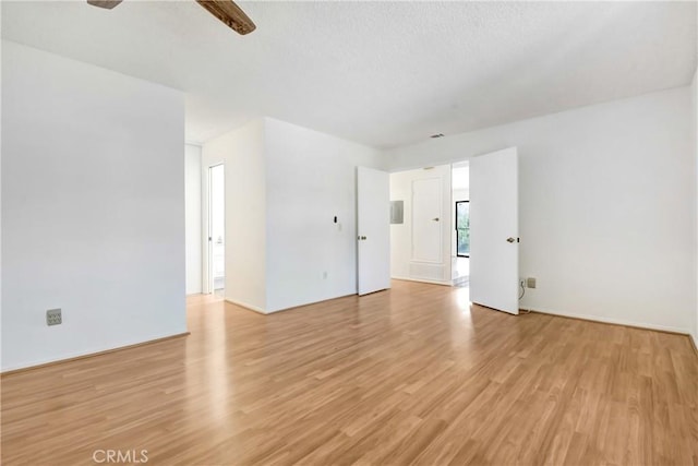 600 Central Ave Unit 372, Riverside, CA 92507 - empty room featuring light wood-style flooring, ceiling fan, and baseboards