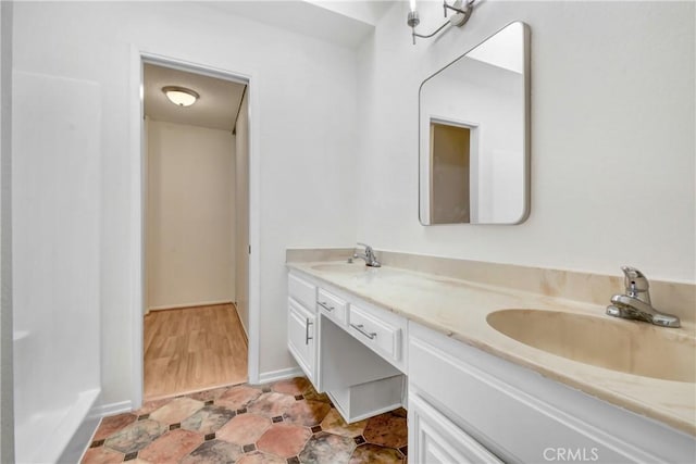 600 Central Ave Unit 372, Riverside, CA 92507 - bathroom featuring double vanity and baseboards