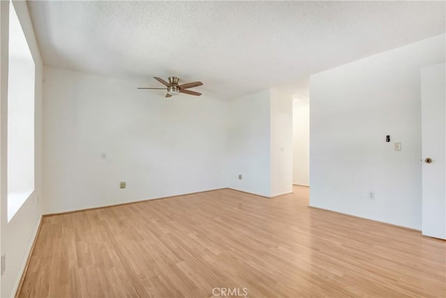 600 Central Ave Unit 372, Riverside, CA 92507 - empty room featuring ceiling fan, light wood-style flooring, and a textured ceiling