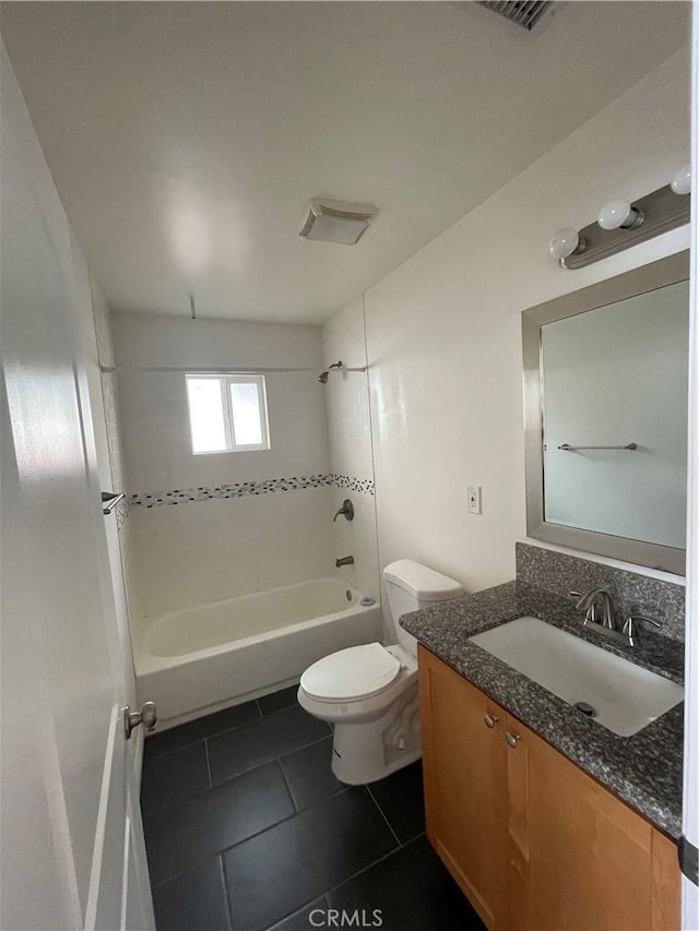 full bathroom with tile patterned floors, washtub / shower combination, toilet, and vanity