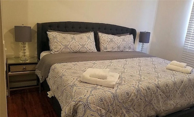 bedroom featuring wood finished floors