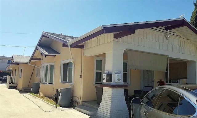 view of side of property with stucco siding