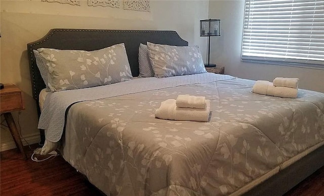 bedroom featuring wood finished floors