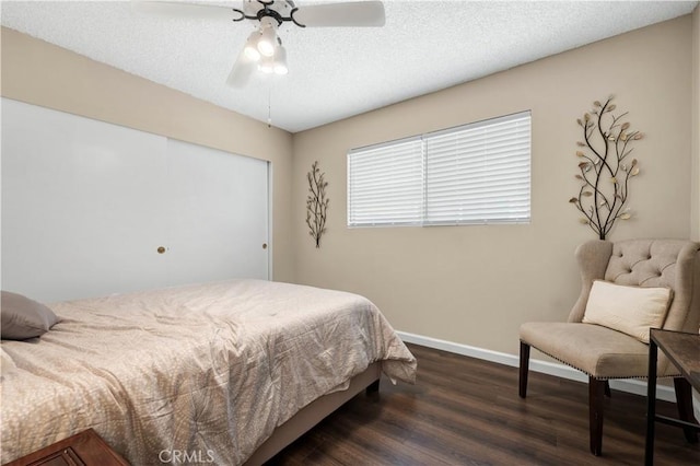 7936 Laramie Ave, Winnetka, CA 91306 - bedroom featuring dark wood finished floors, a closet, baseboards, a textured ceiling, and ceiling fan