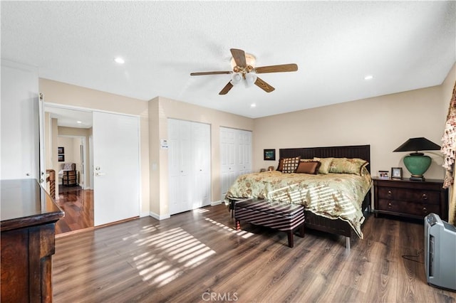 7936 Laramie Ave, Winnetka, CA 91306 - bedroom featuring two closets, wood finished floors, recessed lighting, ceiling fan, and baseboards