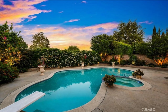 7936 Laramie Ave, Winnetka, CA 91306 - view of pool featuring a diving board, a fenced backyard, a patio, and a pool with connected hot tub