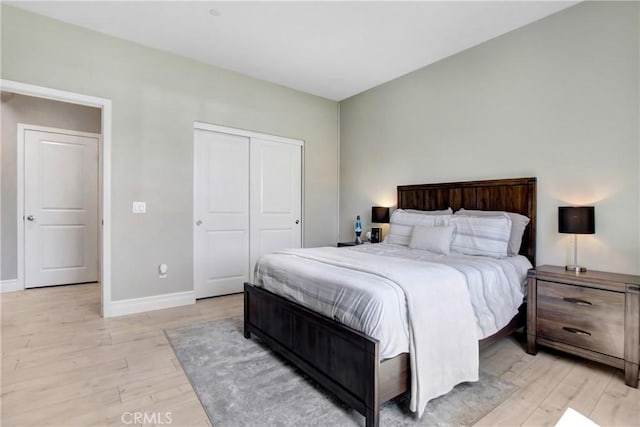 1212 Venice Ave, Mentone, CA 92359 - bedroom with light wood-type flooring, baseboards, and a closet