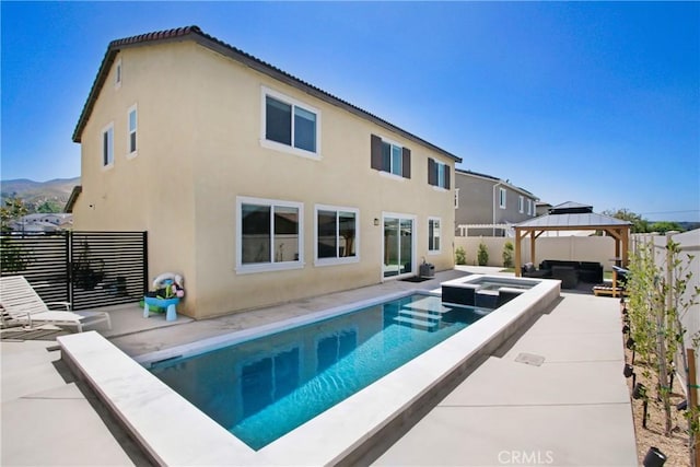 1212 Venice Ave, Mentone, CA 92359 - view of pool featuring a gazebo, a patio, a fenced backyard, an outdoor living space, and a pool with connected hot tub