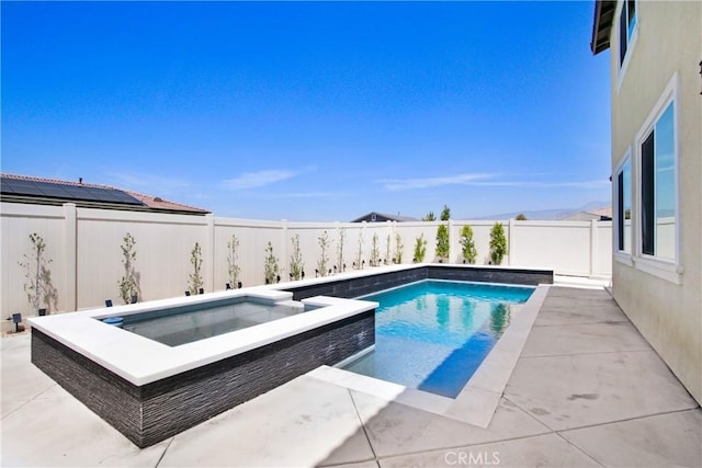 1212 Venice Ave, Mentone, CA 92359 - view of swimming pool featuring a fenced backyard, a pool with connected hot tub, and a patio