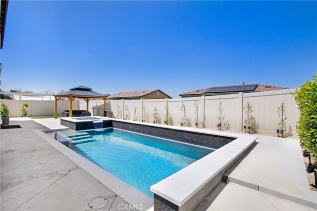 1212 Venice Ave, Mentone, CA 92359 - view of swimming pool featuring a gazebo, a patio, a fenced backyard, and a pool with connected hot tub