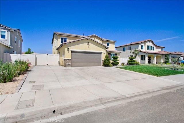 1212 Venice Ave, Mentone, CA 92359 - traditional home with driveway, an attached garage, stone siding, a gate, and stucco siding