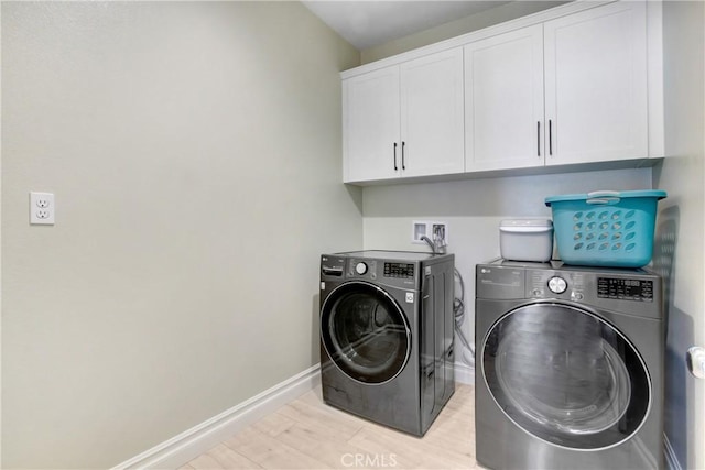 1212 Venice Ave, Mentone, CA 92359 - washroom with cabinet space, separate washer and dryer, baseboards, and light wood-style flooring