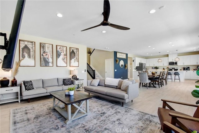 1212 Venice Ave, Mentone, CA 92359 - living room featuring ceiling fan, stairs, recessed lighting, and light wood-style floors