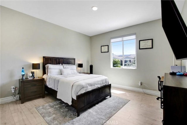 1212 Venice Ave, Mentone, CA 92359 - bedroom featuring baseboards, light wood-style floors, and an office area