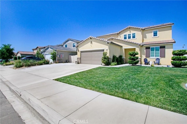 1212 Venice Ave, Mentone, CA 92359 - view of front of house with concrete driveway, stucco siding, a front yard, a garage, and a tiled roof