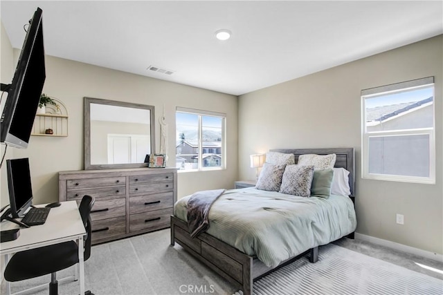 1212 Venice Ave, Mentone, CA 92359 - bedroom with light colored carpet, baseboards, and an office area