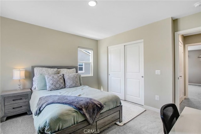 1212 Venice Ave, Mentone, CA 92359 - bedroom featuring light carpet, a closet, and baseboards