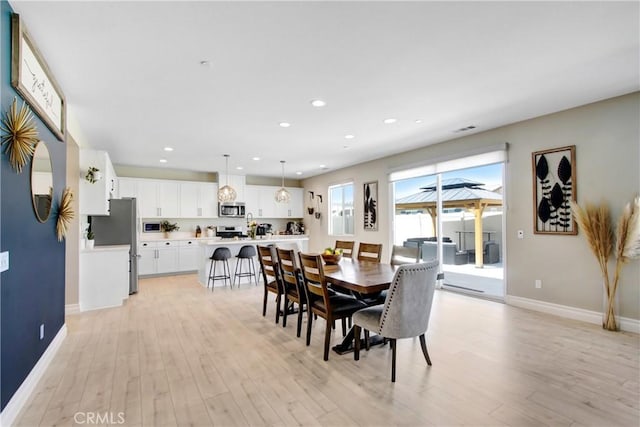 1212 Venice Ave, Mentone, CA 92359 - dining area with light wood-type flooring, baseboards, and recessed lighting