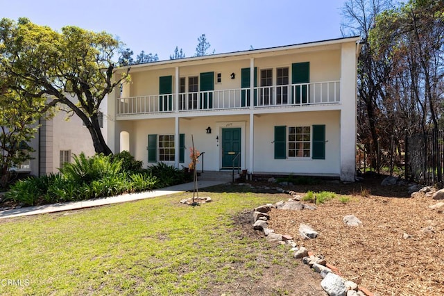 2577 Boulder Rd, Altadena, CA 91001 - view of front facade with a balcony, stucco siding, and a front yard