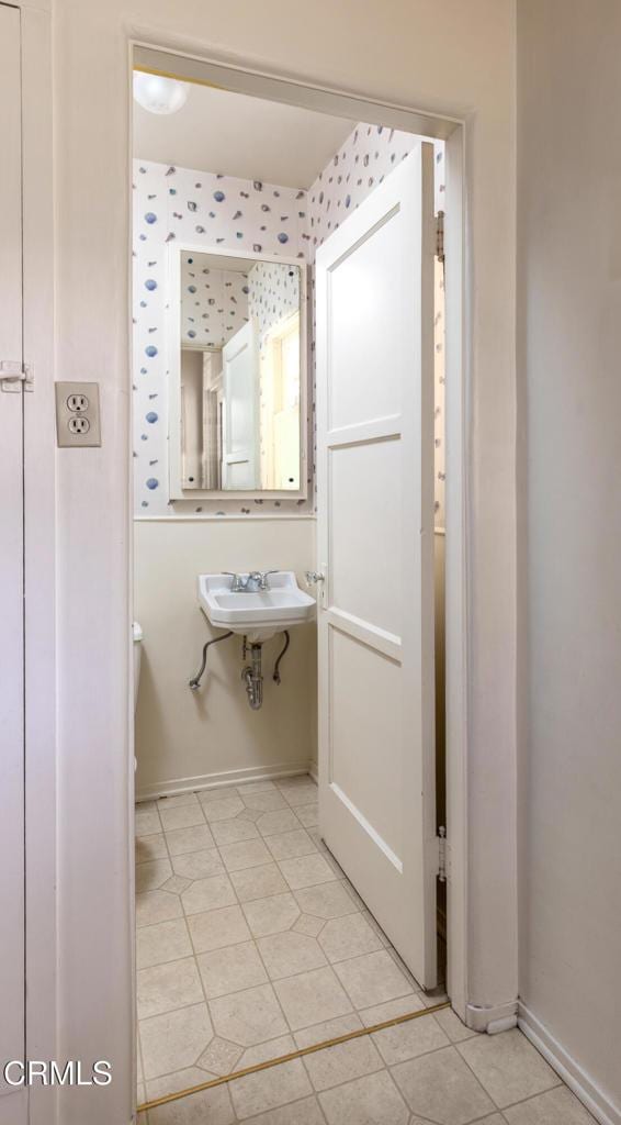2577 Boulder Rd, Altadena, CA 91001 - bathroom featuring baseboards, tile patterned floors, a sink, and toilet