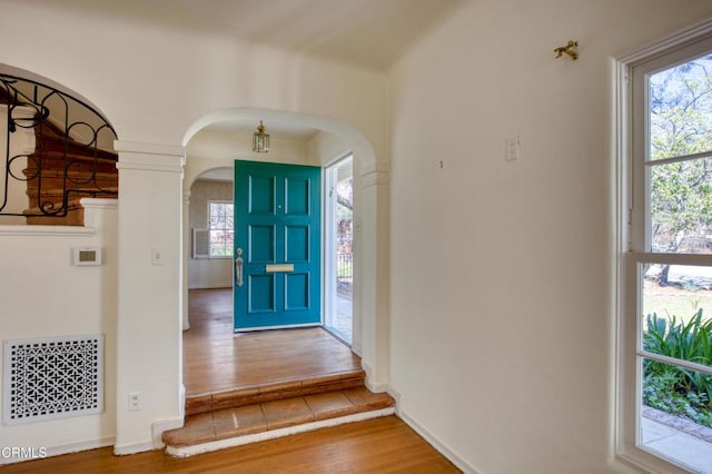 2577 Boulder Rd, Altadena, CA 91001 - entryway with arched walkways, wood finished floors, and baseboards