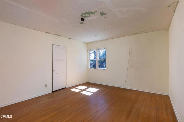 2577 Boulder Rd, Altadena, CA 91001 - unfurnished room featuring wood finished floors and baseboards