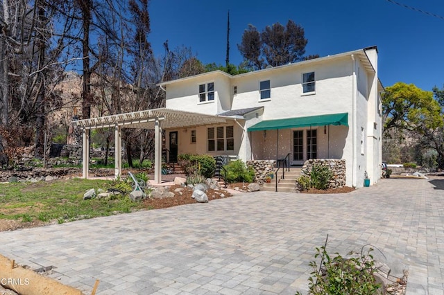 2577 Boulder Rd, Altadena, CA 91001 - rear view of property with stucco siding, a pergola, and driveway