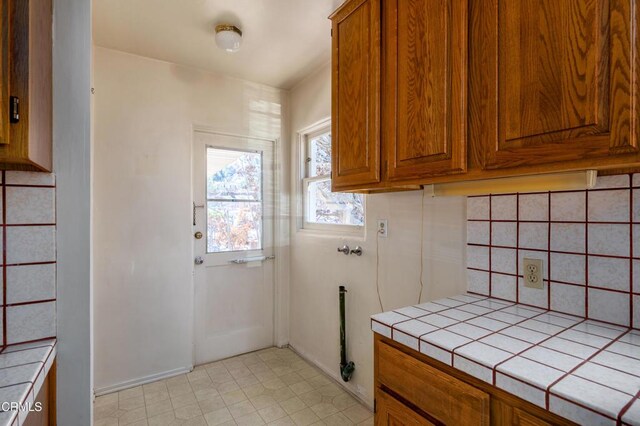 2577 Boulder Rd, Altadena, CA 91001 - laundry room with cabinet space and baseboards