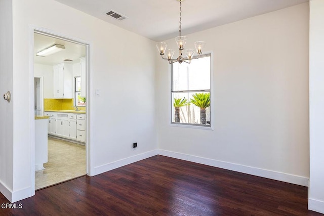 2327 Roscommon Ave, Monterey Park, CA 91754 - unfurnished room with wood finished floors, a chandelier, and baseboards