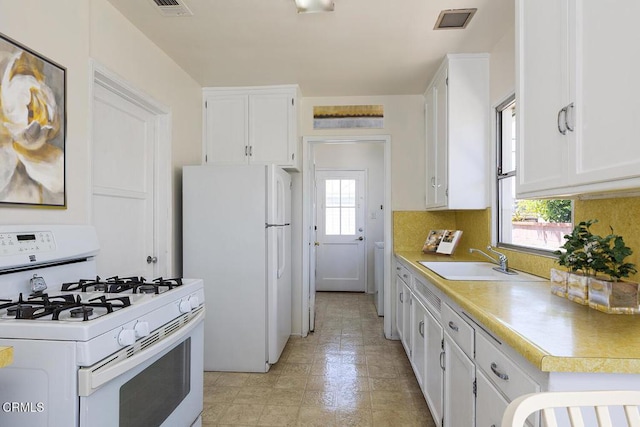 2327 Roscommon Ave, Monterey Park, CA 91754 - kitchen with white appliances, a sink, and white cabinets