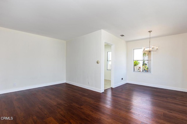 2327 Roscommon Ave, Monterey Park, CA 91754 - spare room featuring a chandelier, wood finished floors, and baseboards