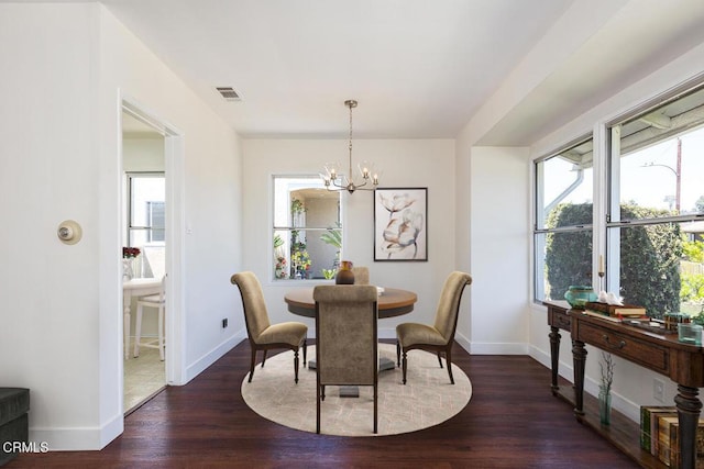 2327 Roscommon Ave, Monterey Park, CA 91754 - dining space with a chandelier, wood finished floors, healthy amount of natural light, and baseboards