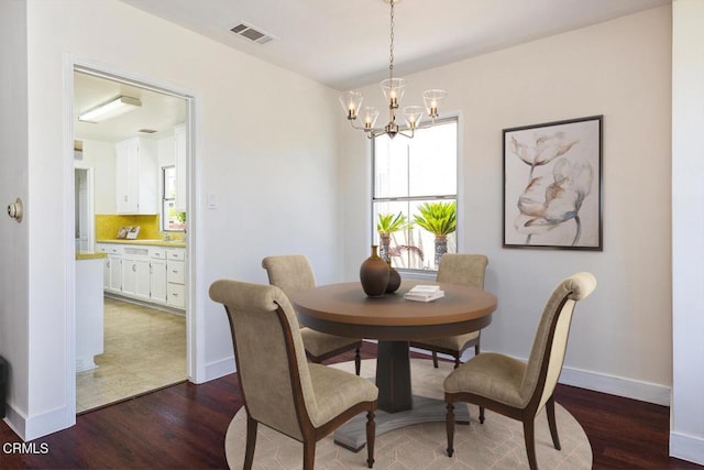 2327 Roscommon Ave, Monterey Park, CA 91754 - dining area featuring dark wood-style floors, a chandelier, and baseboards