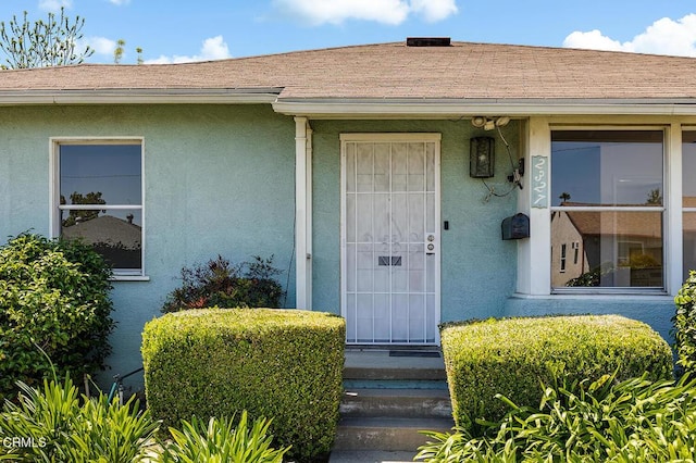 2327 Roscommon Ave, Monterey Park, CA 91754 - property entrance featuring stucco siding and a shingled roof