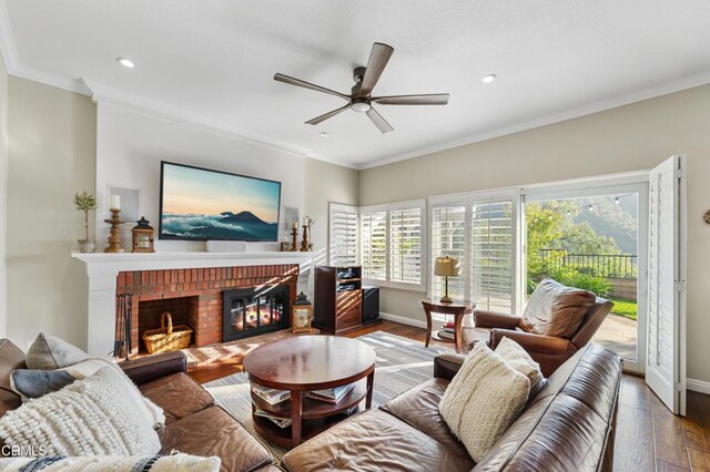 3153 Dragonfly St, Glendale, CA 91206 - living room featuring a ceiling fan, baseboards, wood finished floors, ornamental molding, and a brick fireplace