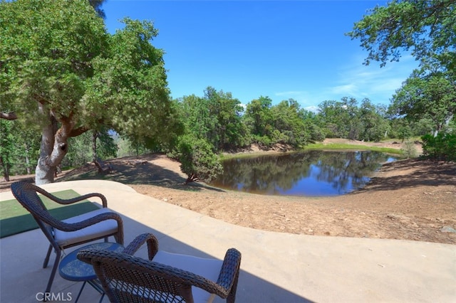 6097 Sherlock Rd, Midpines, CA 95345 - view of patio with a water view