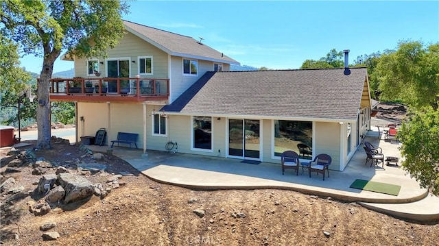 6097 Sherlock Rd, Midpines, CA 95345 - rear view of property with a patio area and a shingled roof
