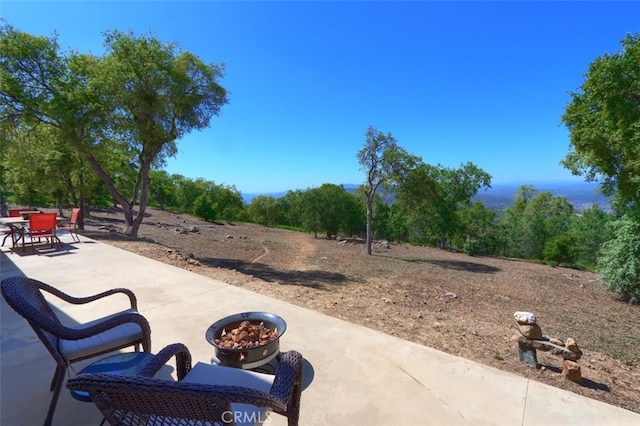 6097 Sherlock Rd, Midpines, CA 95345 - view of patio / terrace featuring a fire pit and outdoor dining space