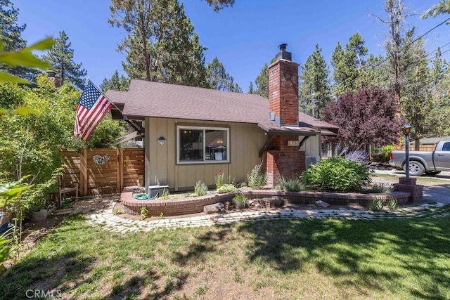 945 Tinker Bell Ave, Big Bear City, CA 92314 - view of front of home featuring a chimney, board and batten siding, and a shingled roof