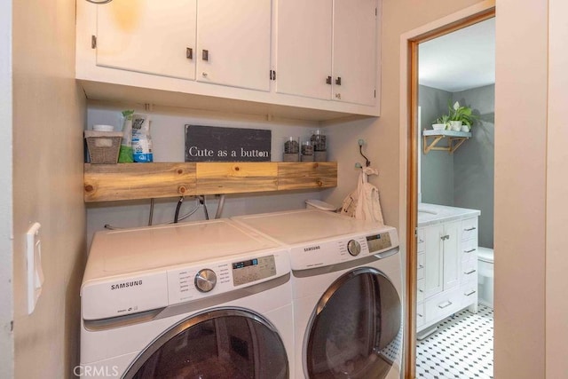 945 Tinker Bell Ave, Big Bear City, CA 92314 - laundry room featuring washer and dryer, cabinet space, and light flooring