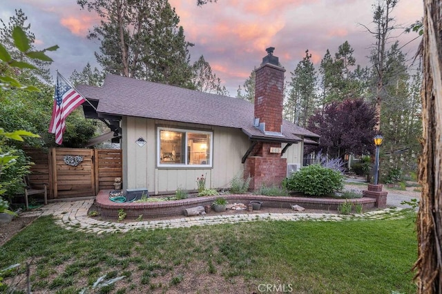 945 Tinker Bell Ave, Big Bear City, CA 92314 - view of front of house featuring a chimney and roof with shingles