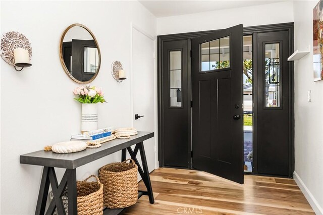 13381 Del Cerro Dr, Tustin, CA 92780 - foyer entrance featuring wood finished floors and baseboards