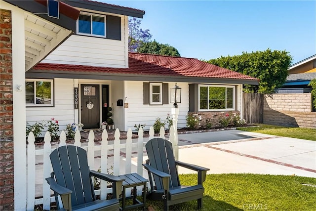 13381 Del Cerro Dr, Tustin, CA 92780 - rear view of property featuring a porch