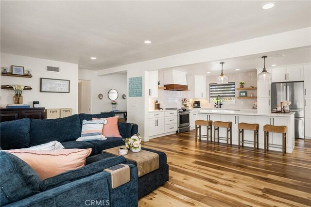 13381 Del Cerro Dr, Tustin, CA 92780 - living room with light wood finished floors and recessed lighting