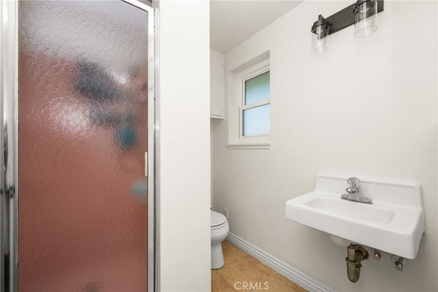 13381 Del Cerro Dr, Tustin, CA 92780 - full bath featuring a stall shower, toilet, tile patterned floors, baseboards, and a sink