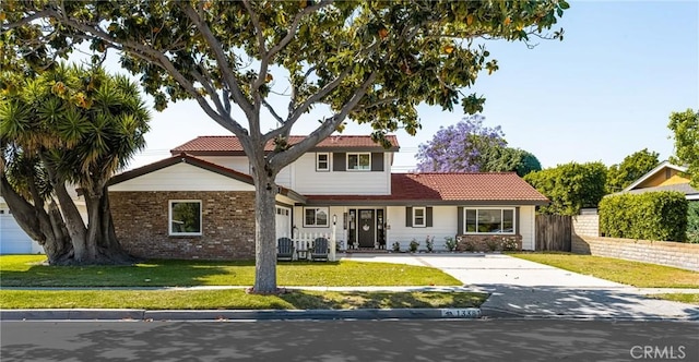 13381 Del Cerro Dr, Tustin, CA 92780 - view of front of house featuring a tile roof and concrete driveway