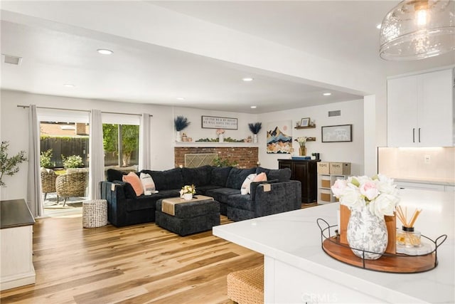 13381 Del Cerro Dr, Tustin, CA 92780 - living area featuring light wood finished floors and recessed lighting