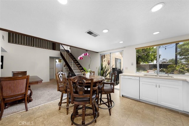 7206 Mimosa Dr, Carlsbad, CA 92011 - dining area with recessed lighting, stairway, and a textured ceiling