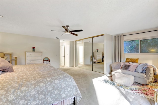 carpeted bedroom with a closet and a ceiling fan