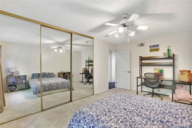 10145 Larwin Ave Unit 2, Chatsworth, CA 91311 - carpeted bedroom featuring a closet, ceiling fan, and a textured ceiling